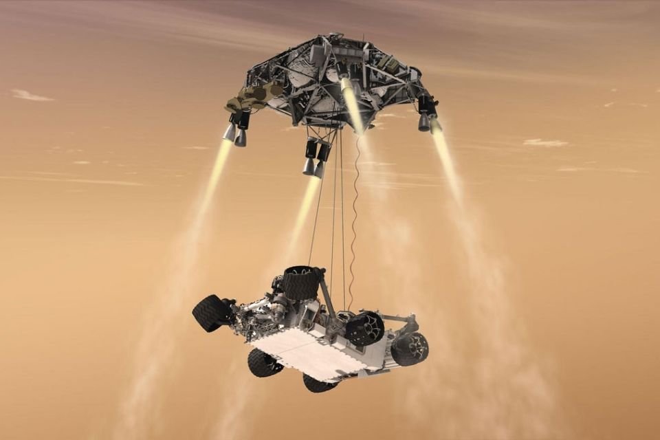 Manobra do guindaste no céu, durante a descida do rover Curiosity da NASA até a superfície marciana.