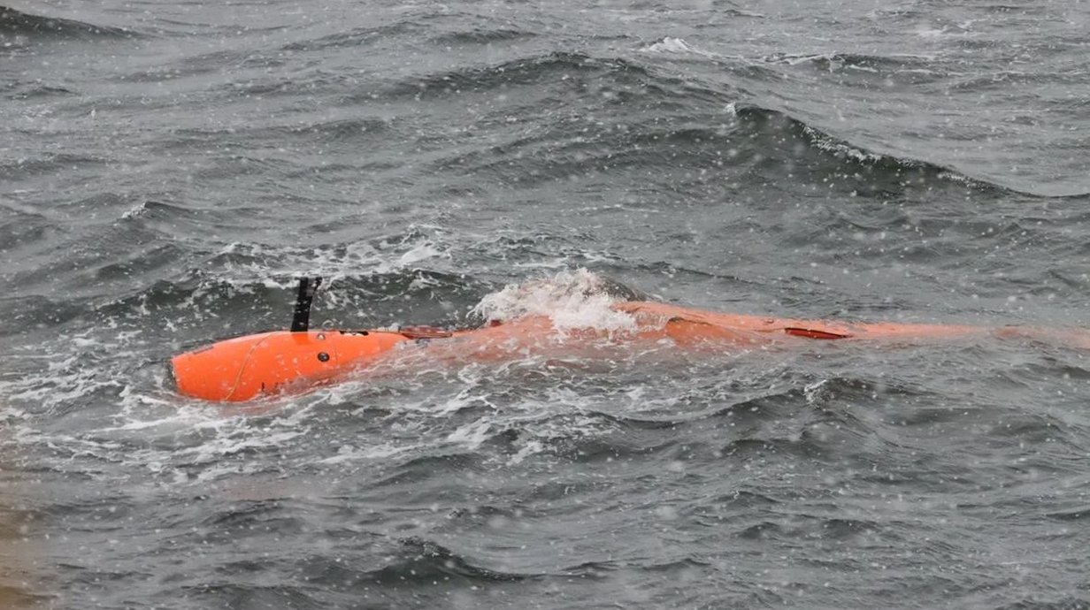 photograph-of-an-orange-long-rov-surfacing-in-choppy-grey-water-l.jpg